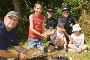 Clive Archer with youngsters catch