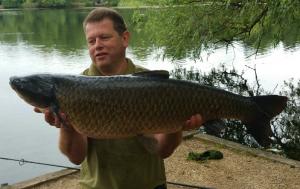 Dennis Rowe 33lb grass carp on the surface in the A2 lake centre path 29.6.17