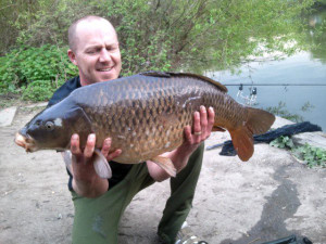 Paul Badrik - 23lb 14oz common from brooklands lakes on 16/04/2011 fished at 70 yards in silt on blow back rig on a long shank hook and coated braid with 1 inch stripped back from hook. 16mm boilie fished with a 10mm pop up(snowman) with approx 100 boilies scattered.