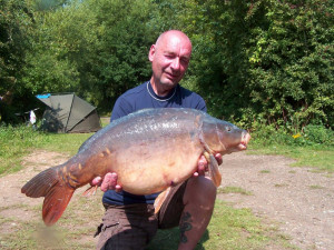 Sam Rozier 32Lb 8oz Mirror which is the largest carp to come out of Horton Kirby in many years. The fish was caught on an 11mm Dairy Cream pop up over a bed of 14mm club mix boilies.The bait was attached to a size 8 Solar strong hold long shank with a 25lb Solar easy strip hooklink - 28.7.11