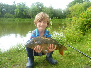 William Benningfield 8 yrs Sutton at Hone 8.7.12 Dads and Lads Lake first ever Carp and 3 others to 9lbs
