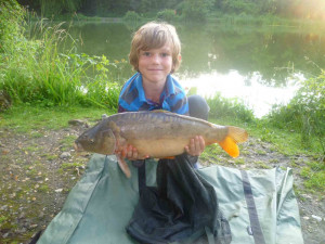 William Benningfield 8 yrs Sutton at Hone 8.7.12 Dads and Lads Lake first ever Carp and 3 others to 9lbs 4