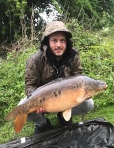Arron Stewart 23Lb 1oz Sutton Big Lake - from the dugout swim, cast out to the middle of the lake on a hard spot I found, the rod went at first light Saturday morning on a mainline essential ib pop up fished with a Ronnie rig on a helicopter set up 15.5.21